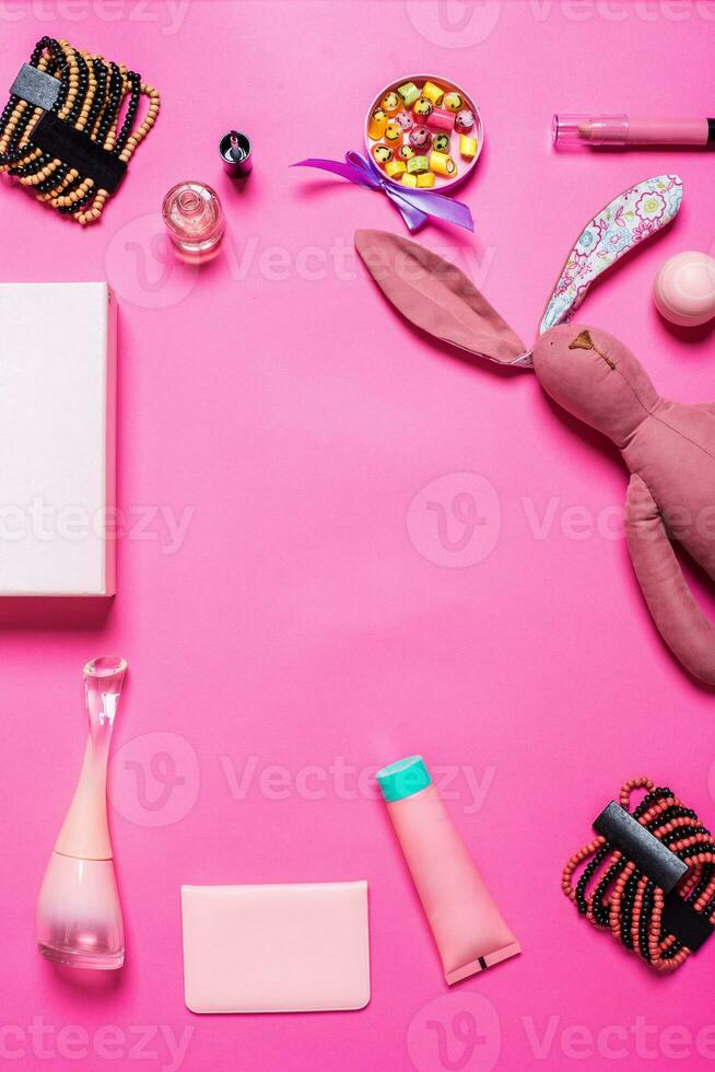 Girl's accessories on a pink background photo