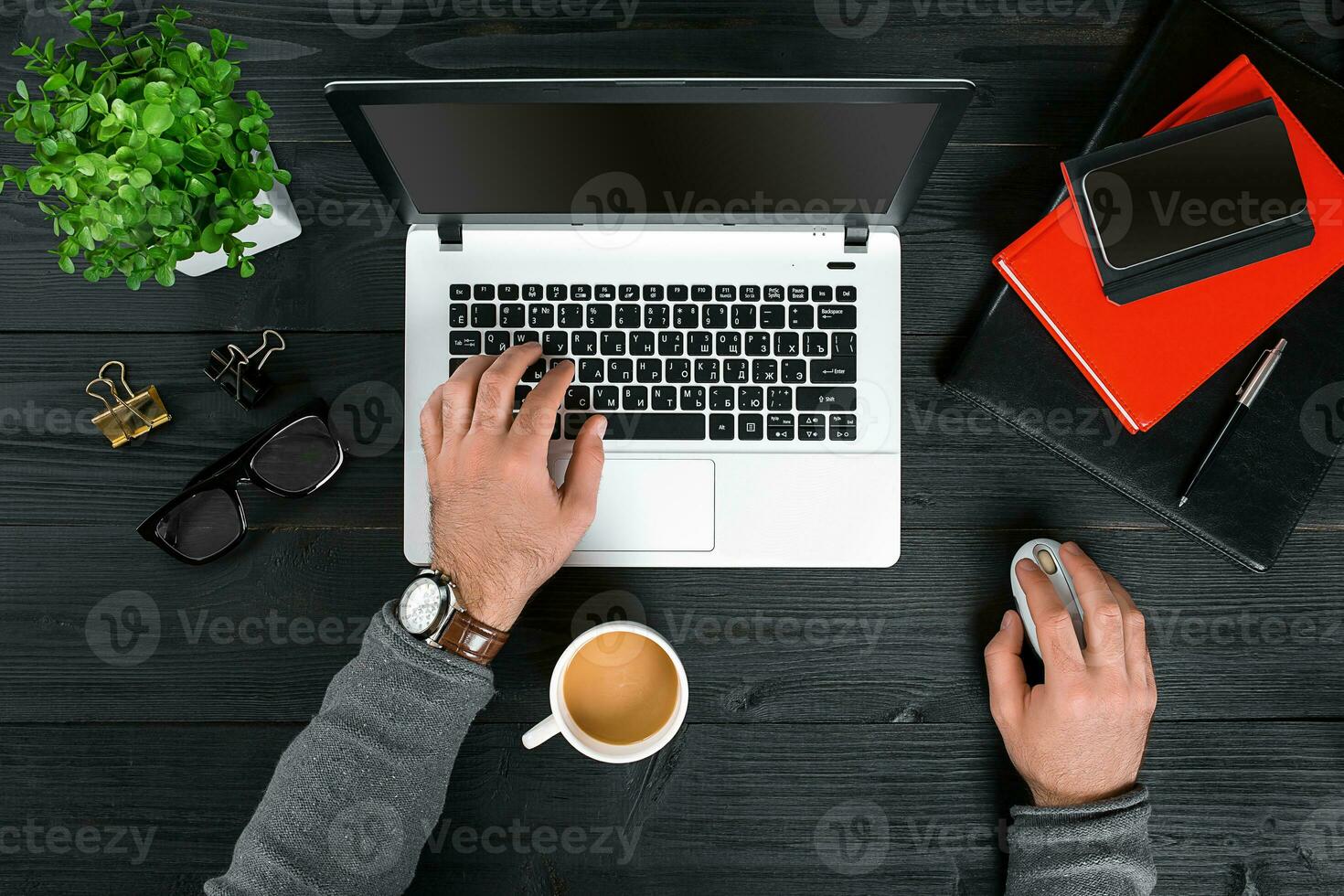 Directly above view of human hands typing on laptop. photo