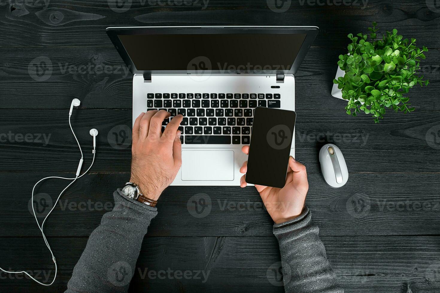 Directly above view of human hands typing on laptop. photo