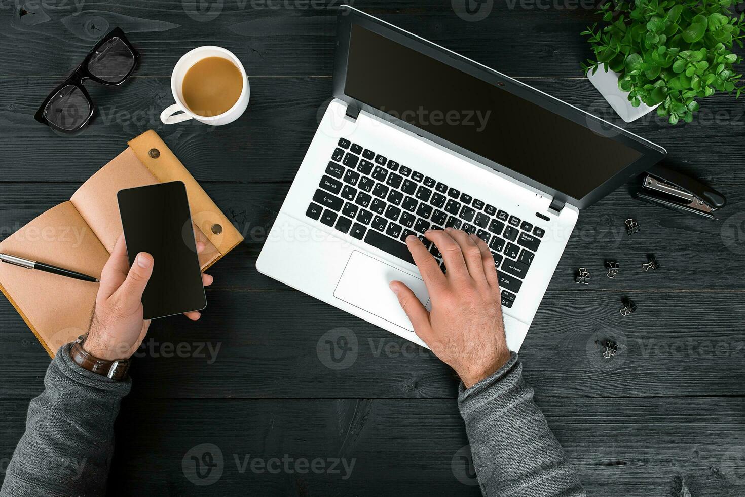 Directly above view of human hands typing on laptop. photo