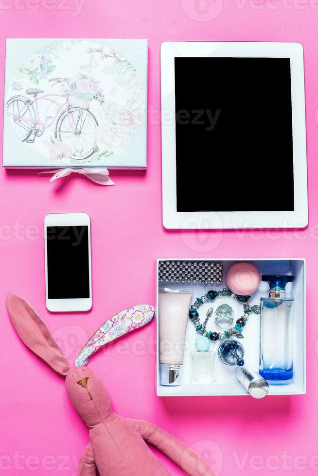 Girl's accessories on a pink background photo