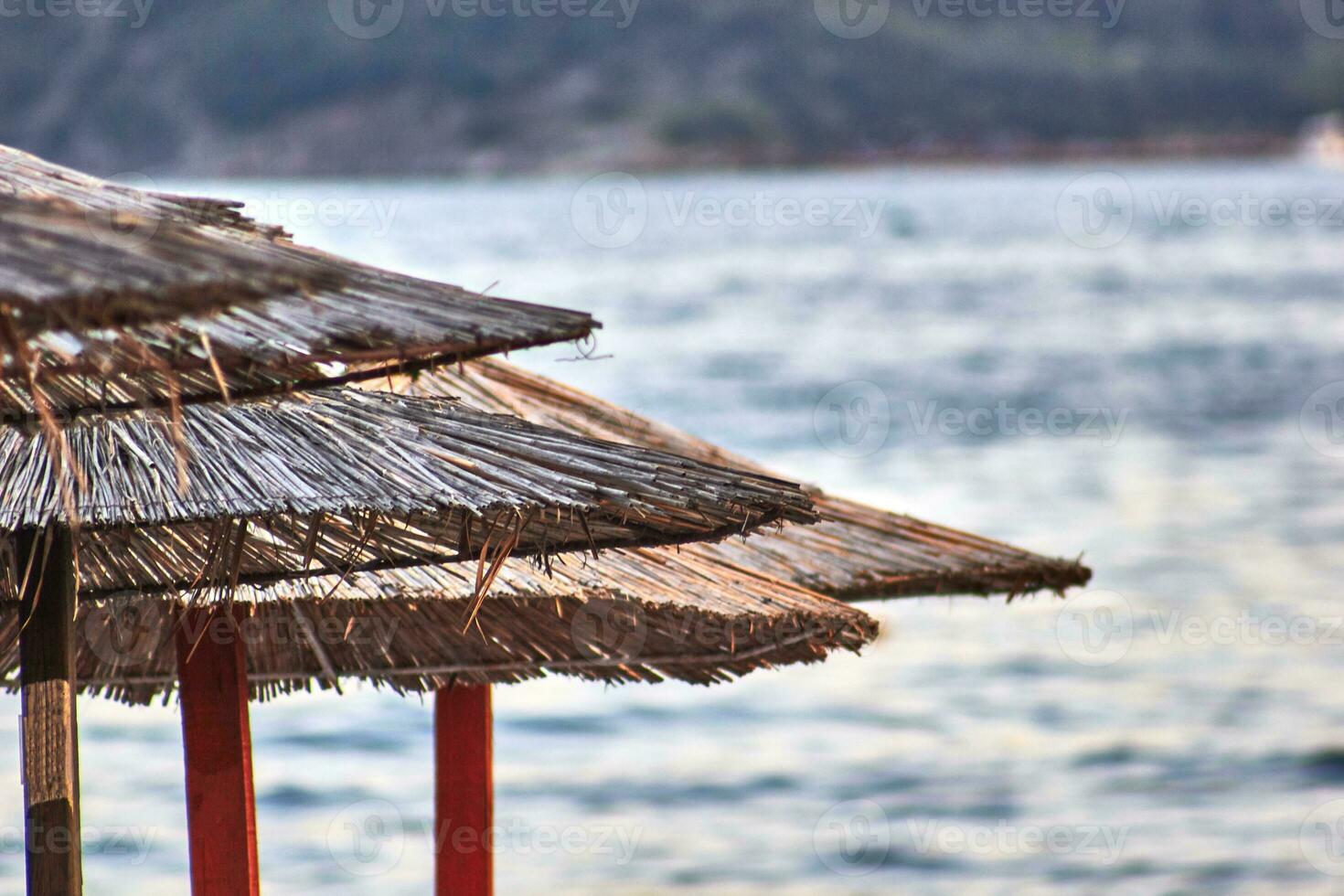 Sun loungers and umbrellas are on the beach in Budva, Montenegro. photo