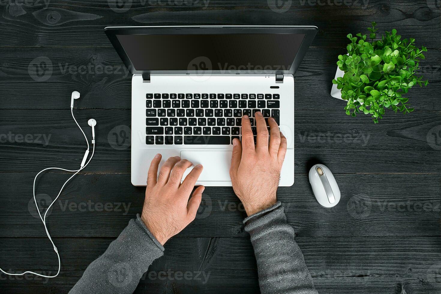Directly above view of human hands typing on laptop. photo