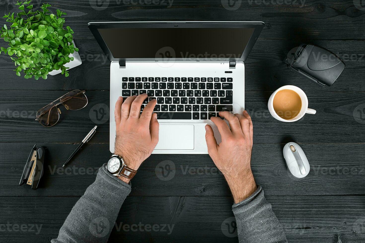 Directly above view of human hands typing on laptop. photo