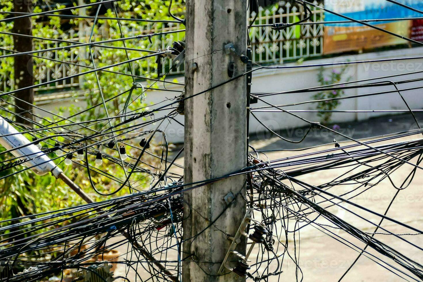 a pole with many wires attached to it photo