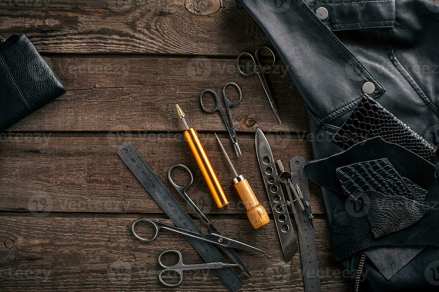 Leather products. Work place craftsman in a workshop. Top view photo