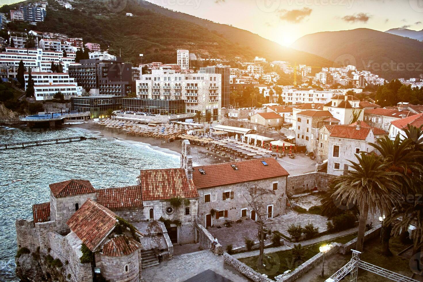 Red roofs of Budva in Montenegro. Sun flare photo