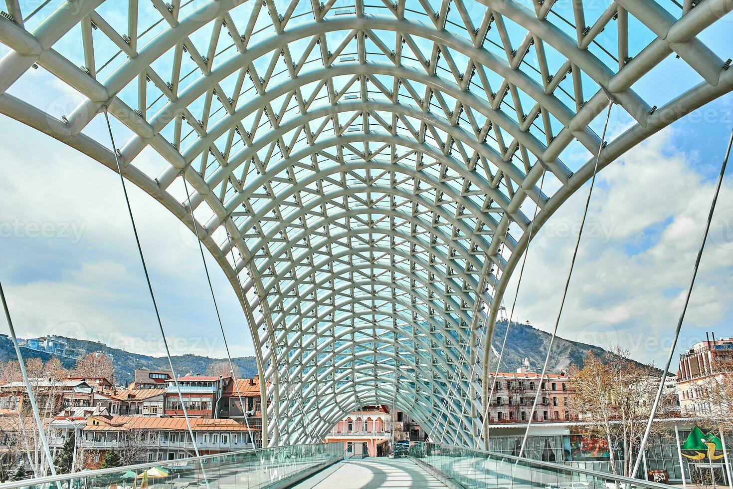 The Bridge of Peace is pedestrian bridge over the Kura River in Tbilisi, capital of Georgia. photo