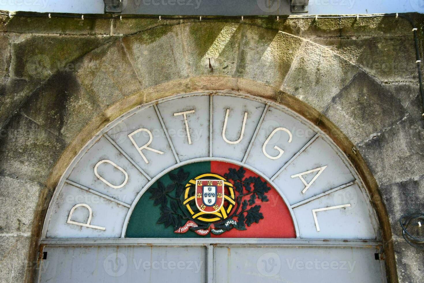 portugal flag on the door of a building photo