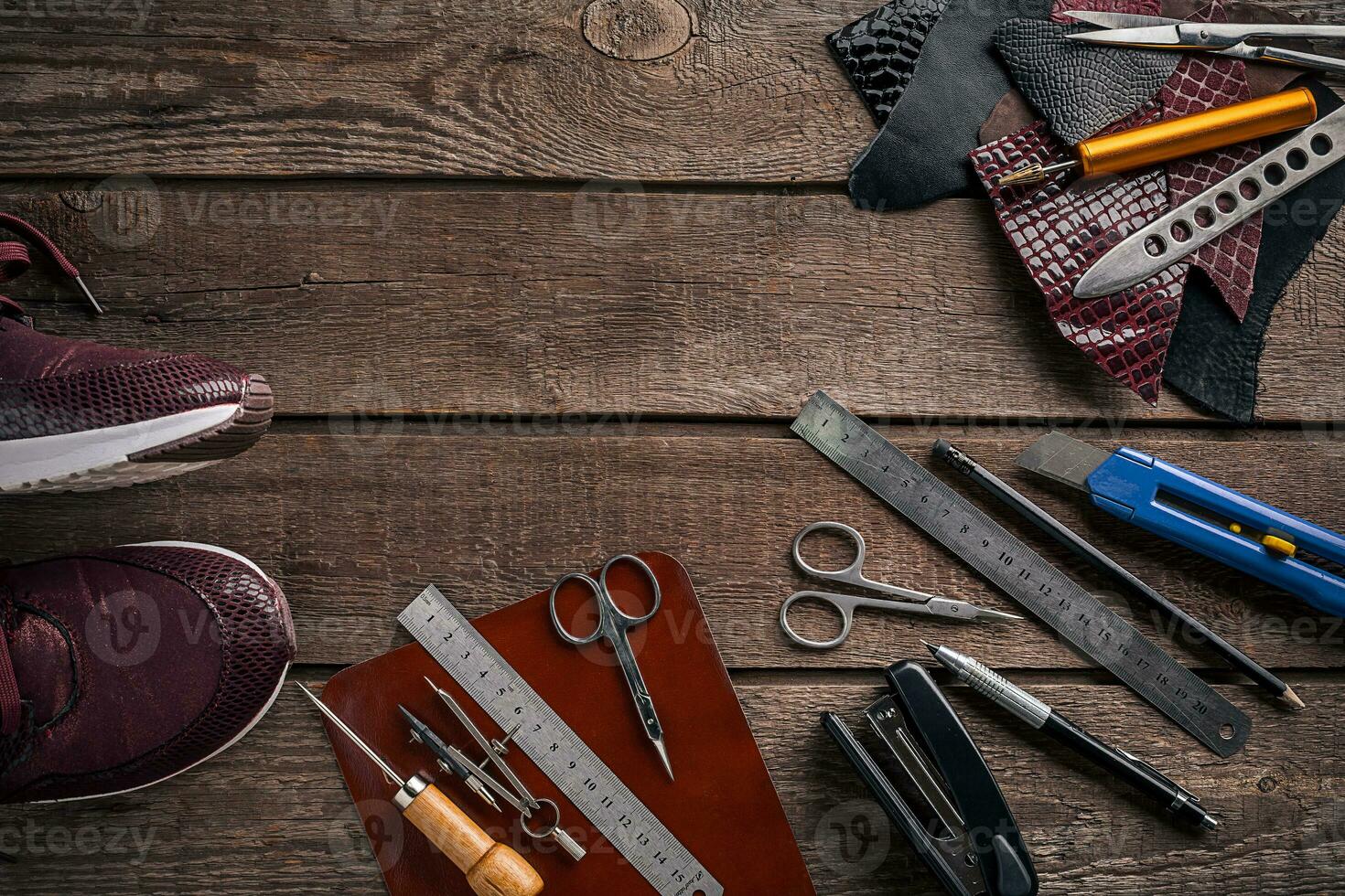 Leather products. Work place craftsman in a workshop. Top view photo