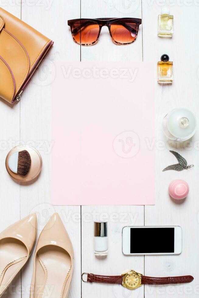 Women's clothes and accessories on a white background photo