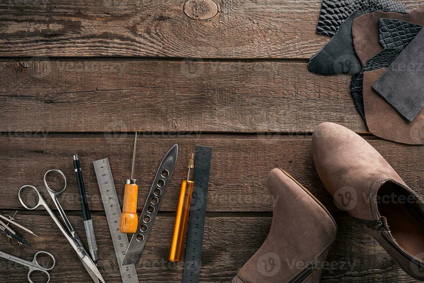 Leather products. Work place craftsman in a workshop. Top view photo
