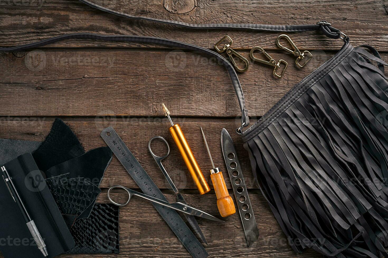 Leather products. Work place craftsman in a workshop. Top view photo