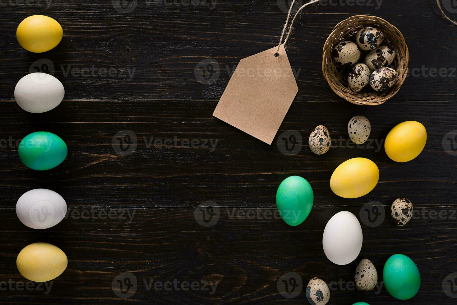 Greeting card with paschal eggs on rustic, wood table photo