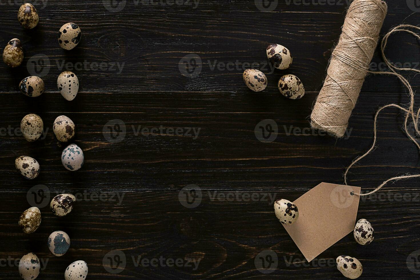 quail eggs, place for text on wooden rustic background top view close up photo
