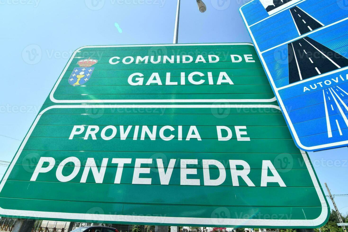 a road sign that reads comunidad de galicia photo