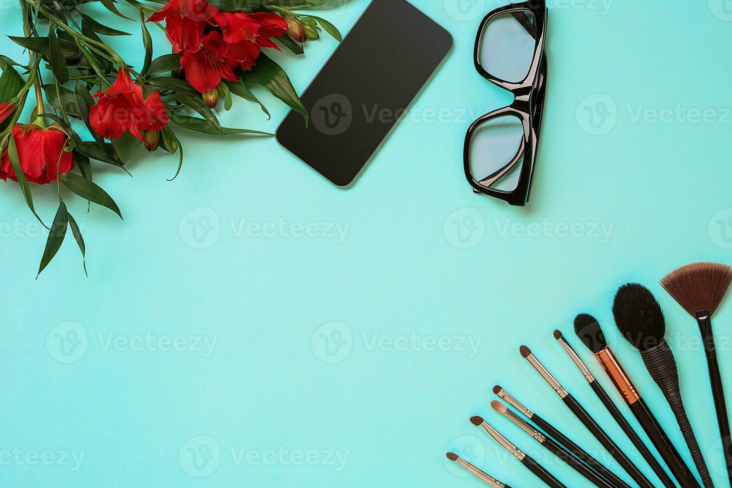 Make up essentials. Set of professional make up brushes on blue background. photo