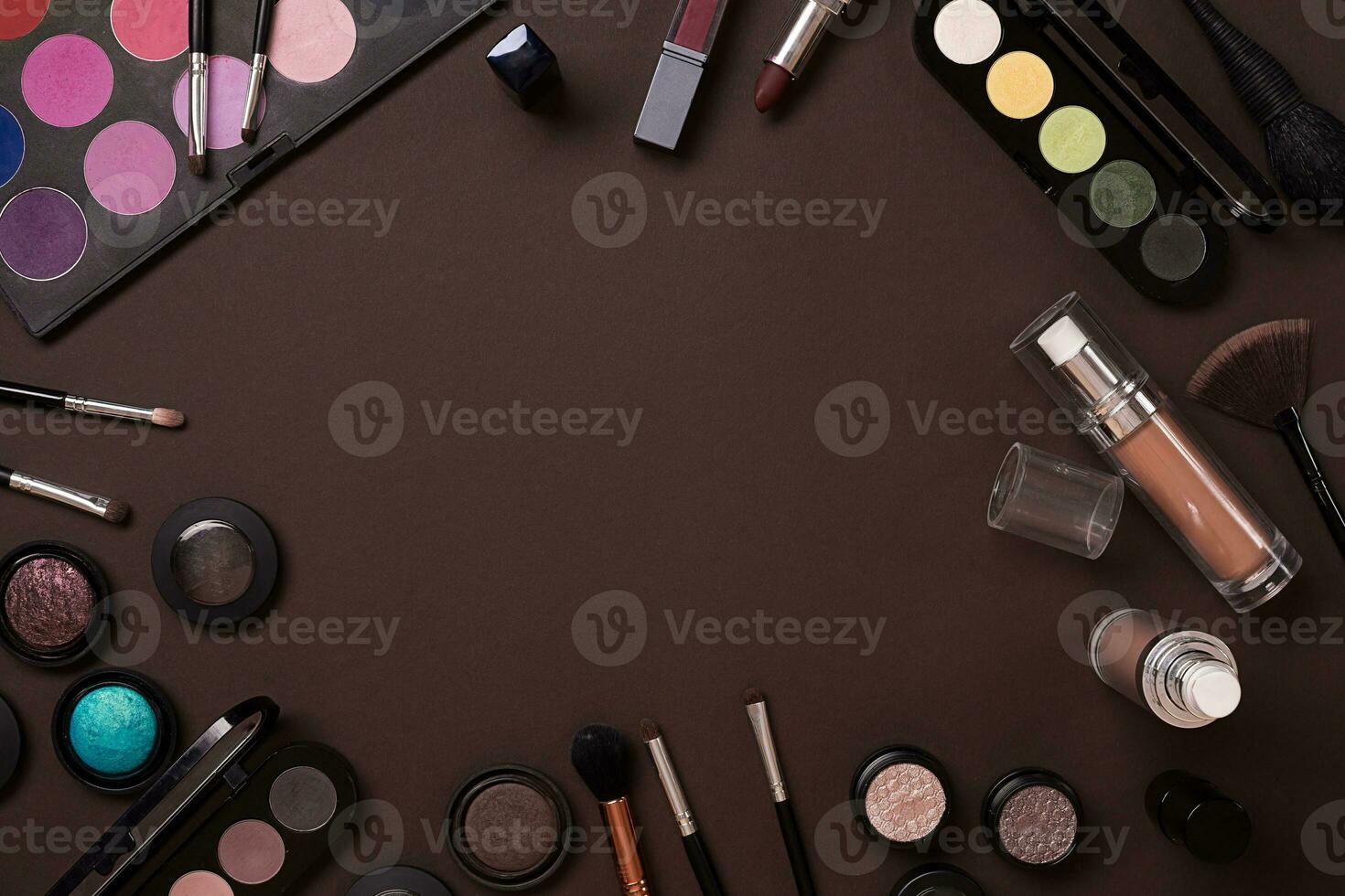 The women's cosmetics set on a brown background, modern woman. photo