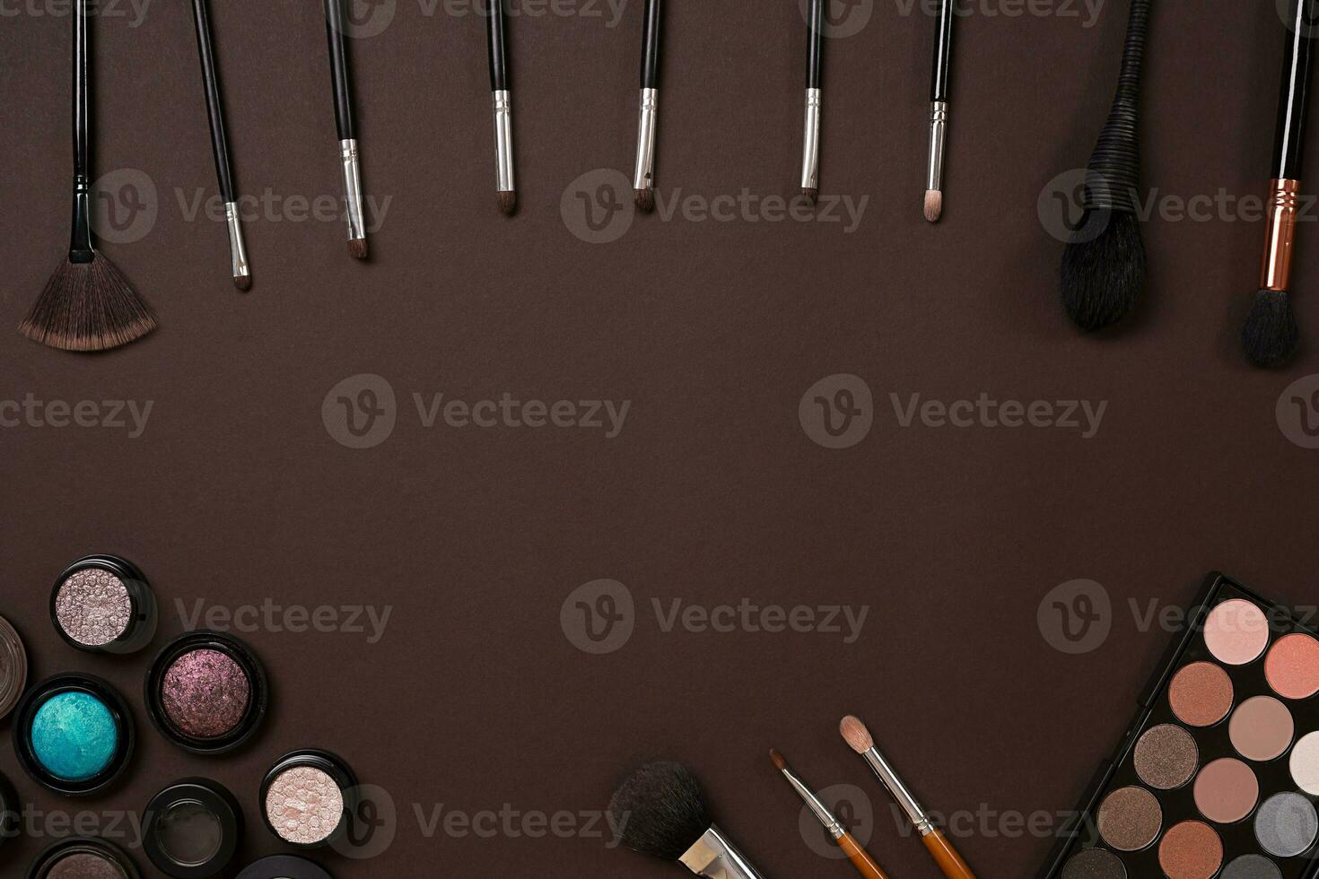 brush for makeup, eye shadow, view from above. On a brown background photo