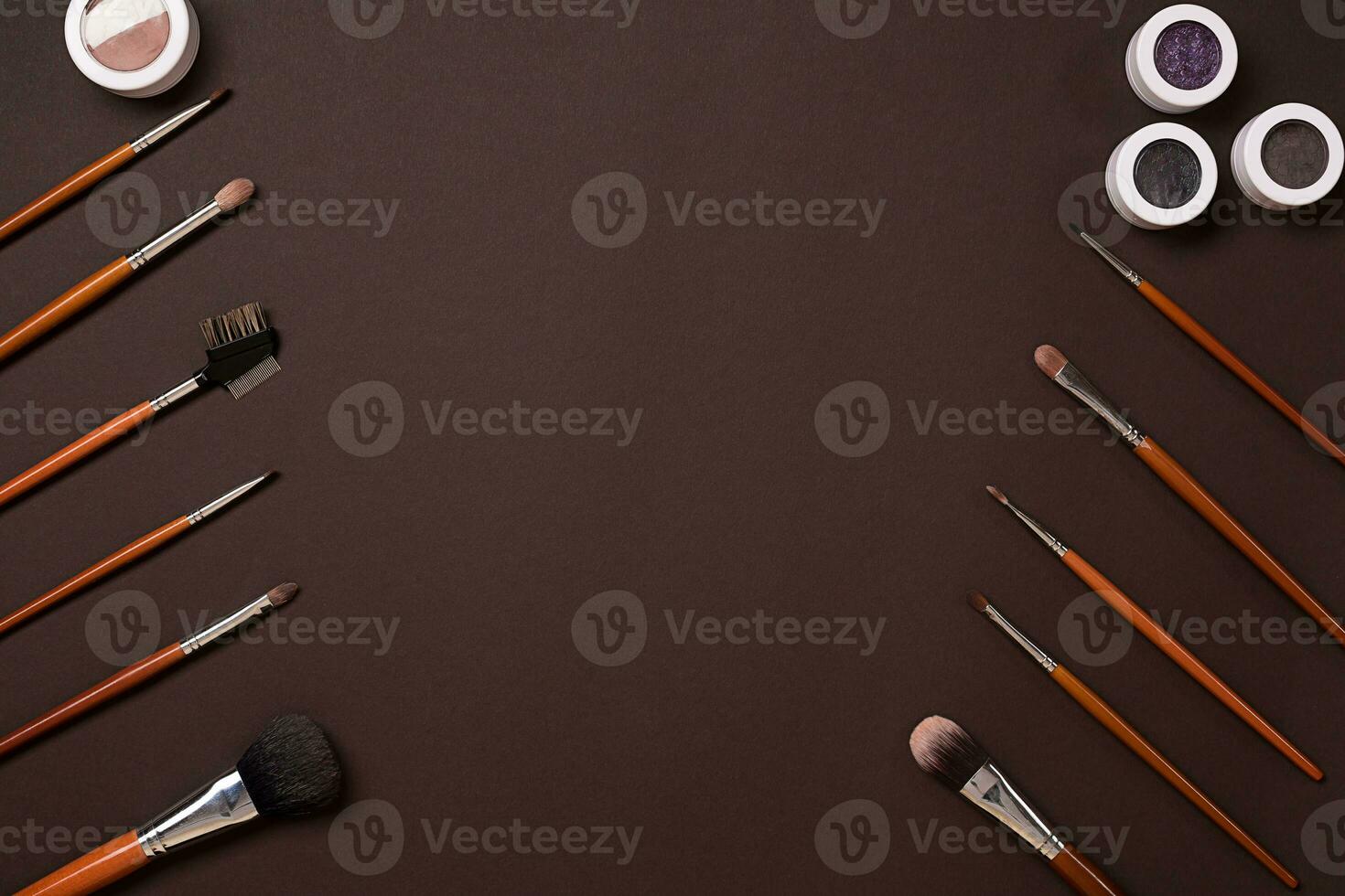 brush for makeup, eye shadow, view from above. On a brown background photo