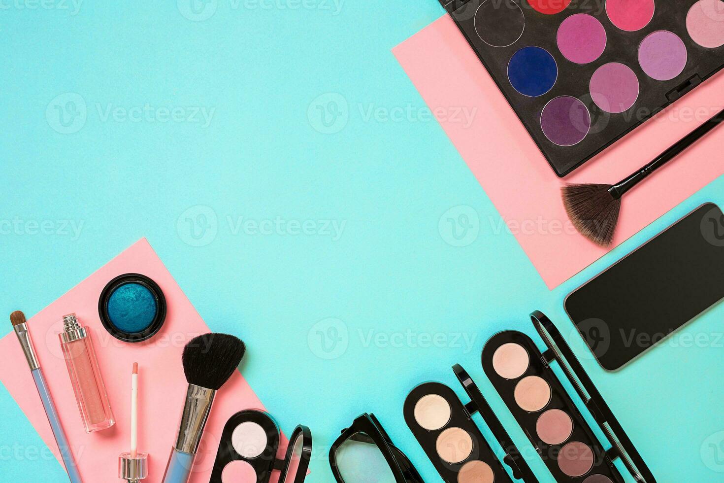 The women's cosmetics set on a blue background, modern woman. photo