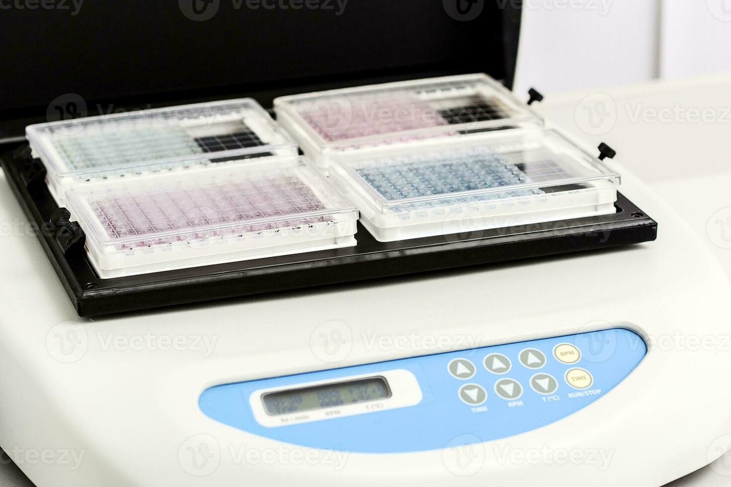 A chemical sample bottle. Centrifuge. A test tube vial sets for analysis. photo