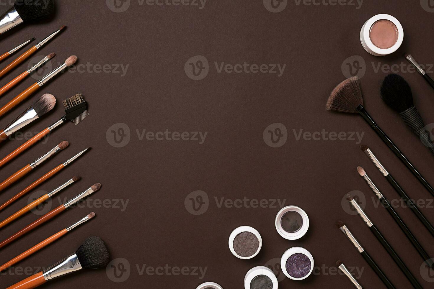 brush for makeup, eye shadow, view from above. On a brown background photo