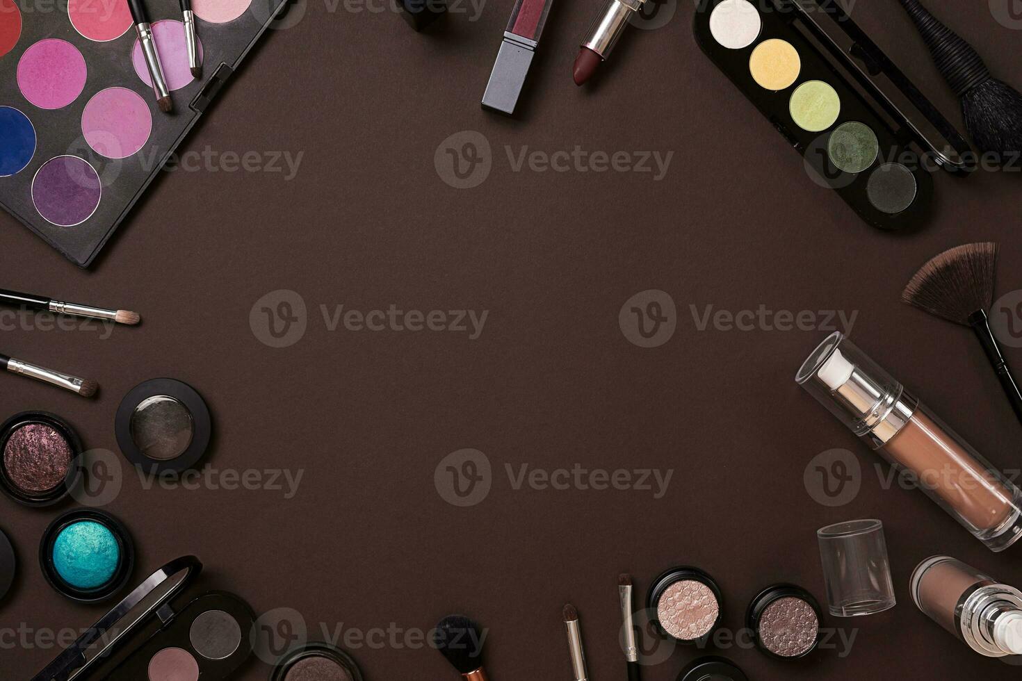 The women's cosmetics set on a brown background, modern woman. photo