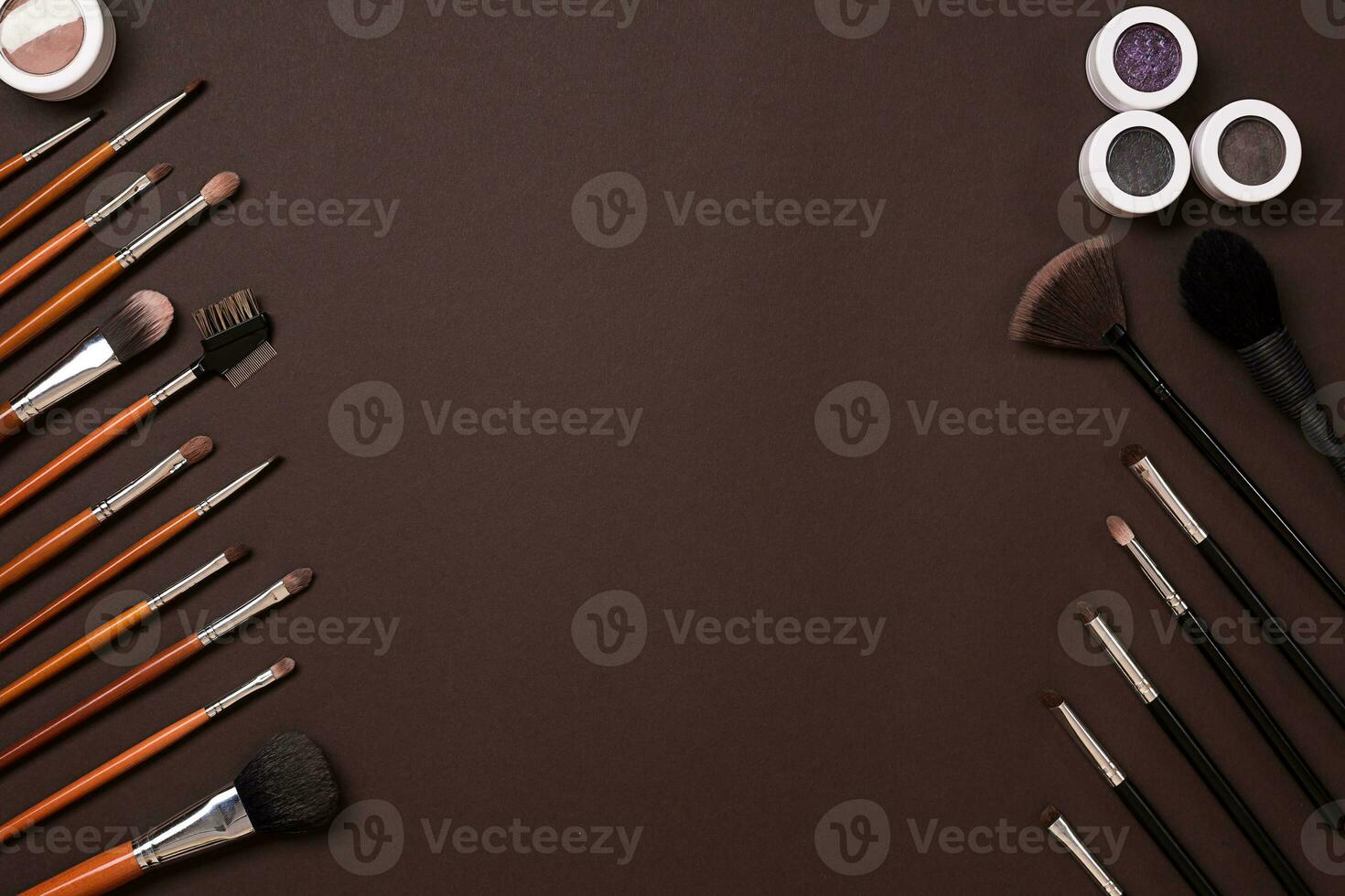 brush for makeup, eye shadow, view from above. On a brown background photo