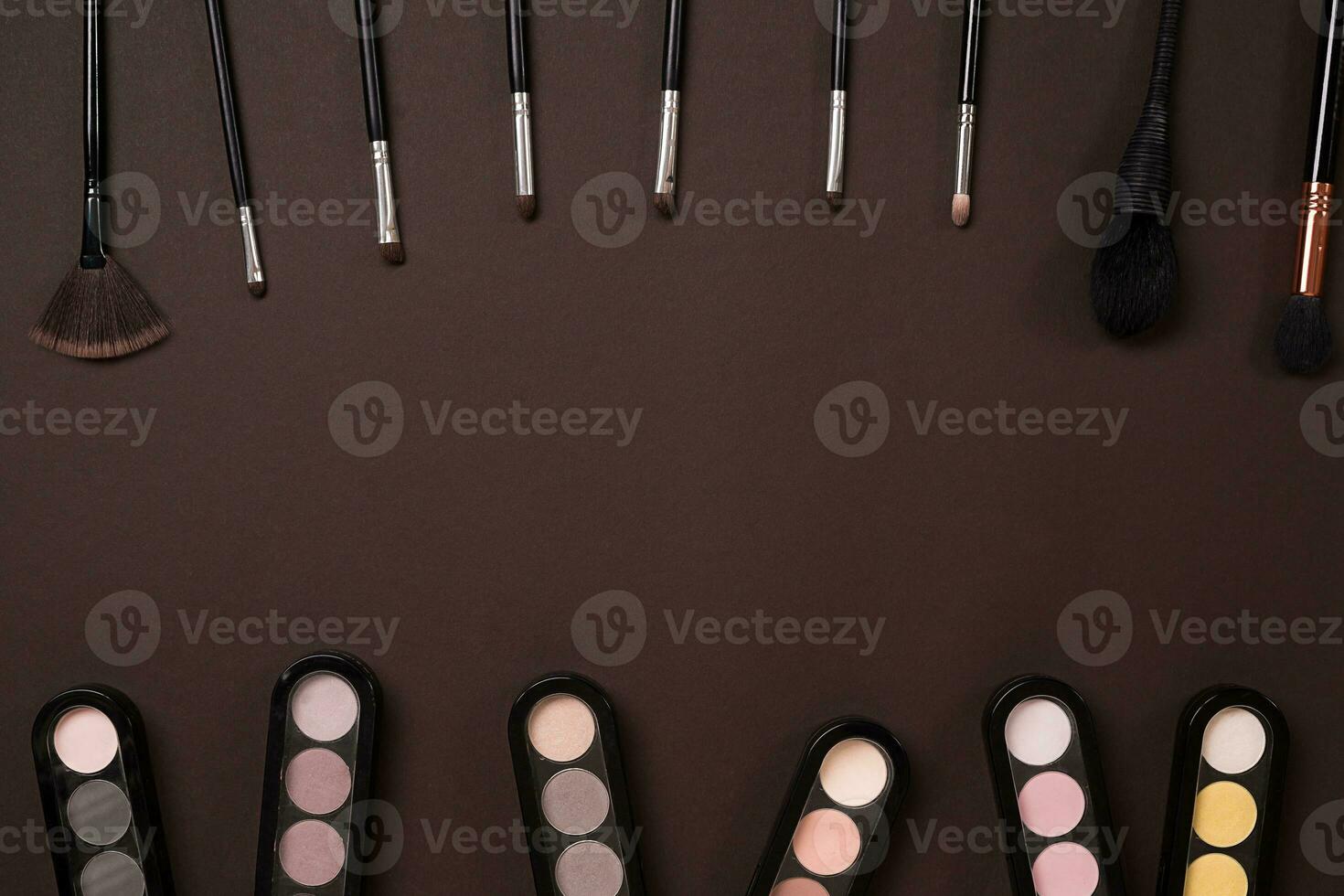 brush for makeup, eye shadow, view from above. On a brown background photo