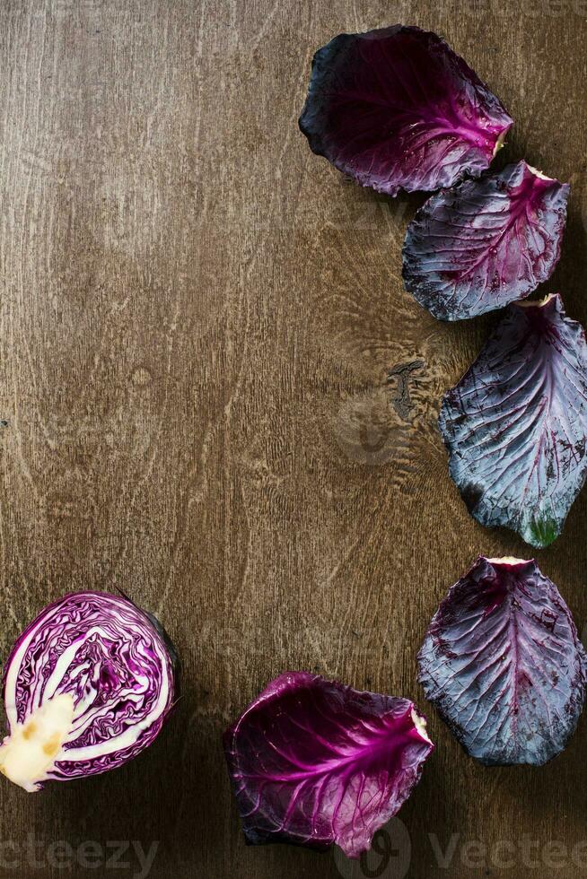 leaf red cabbage slate and wooden counter top background photo