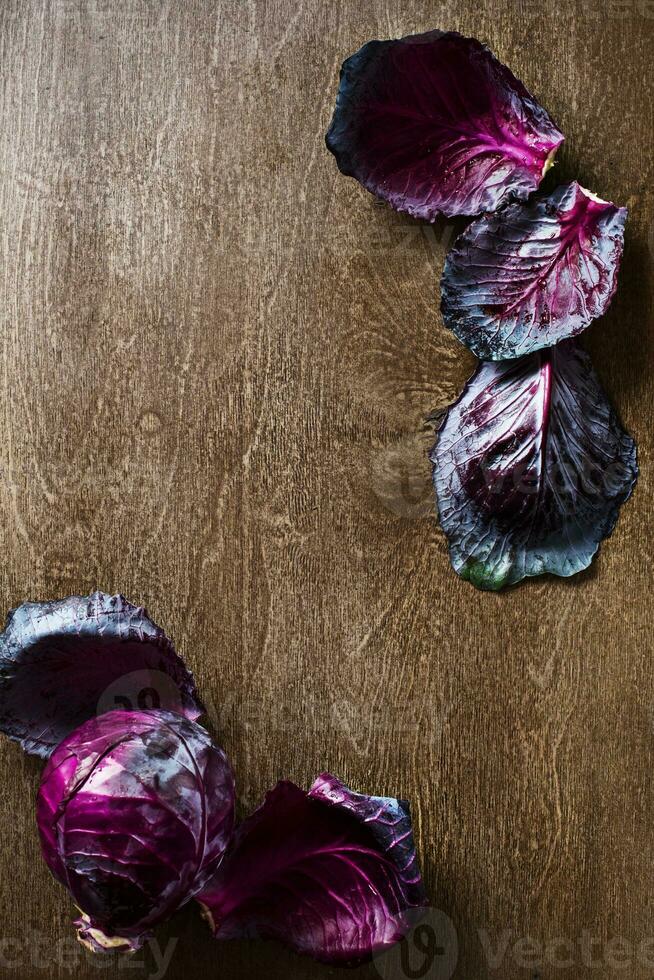 leaf red cabbage slate and wooden counter top background photo