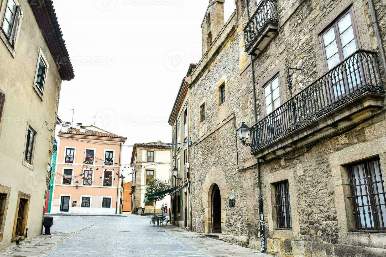 a narrow street in the old town of valencia, spain photo