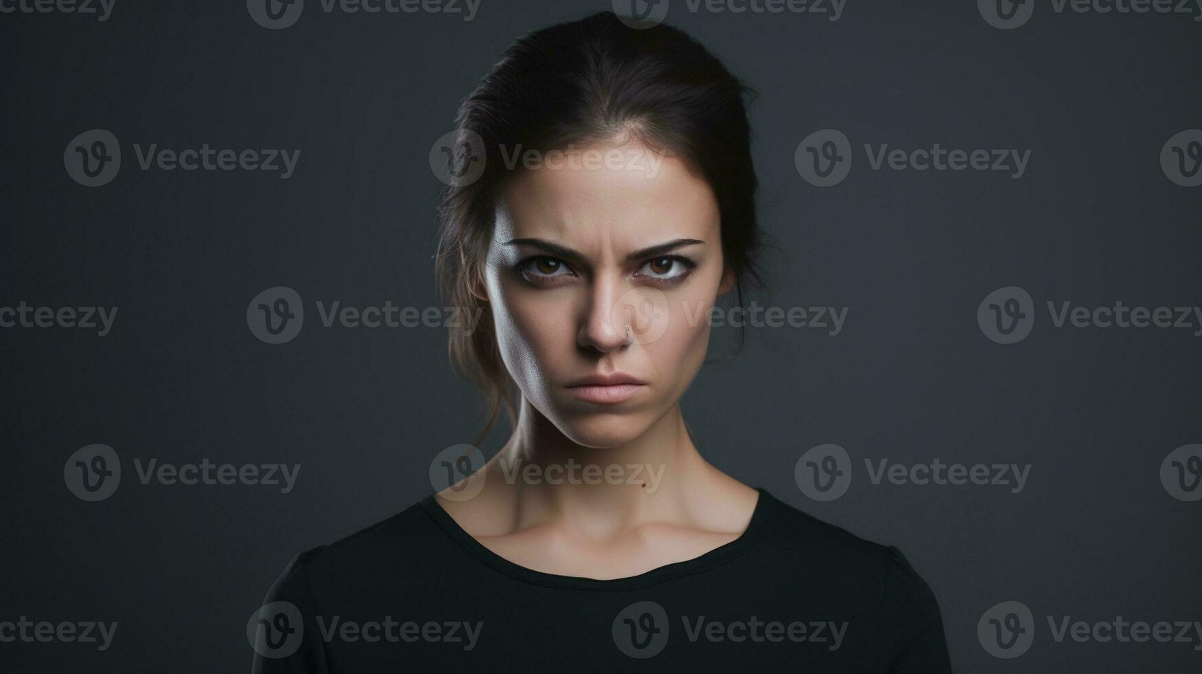Angry Woman Looking at the Camera Isolated on the Minimalist Background photo