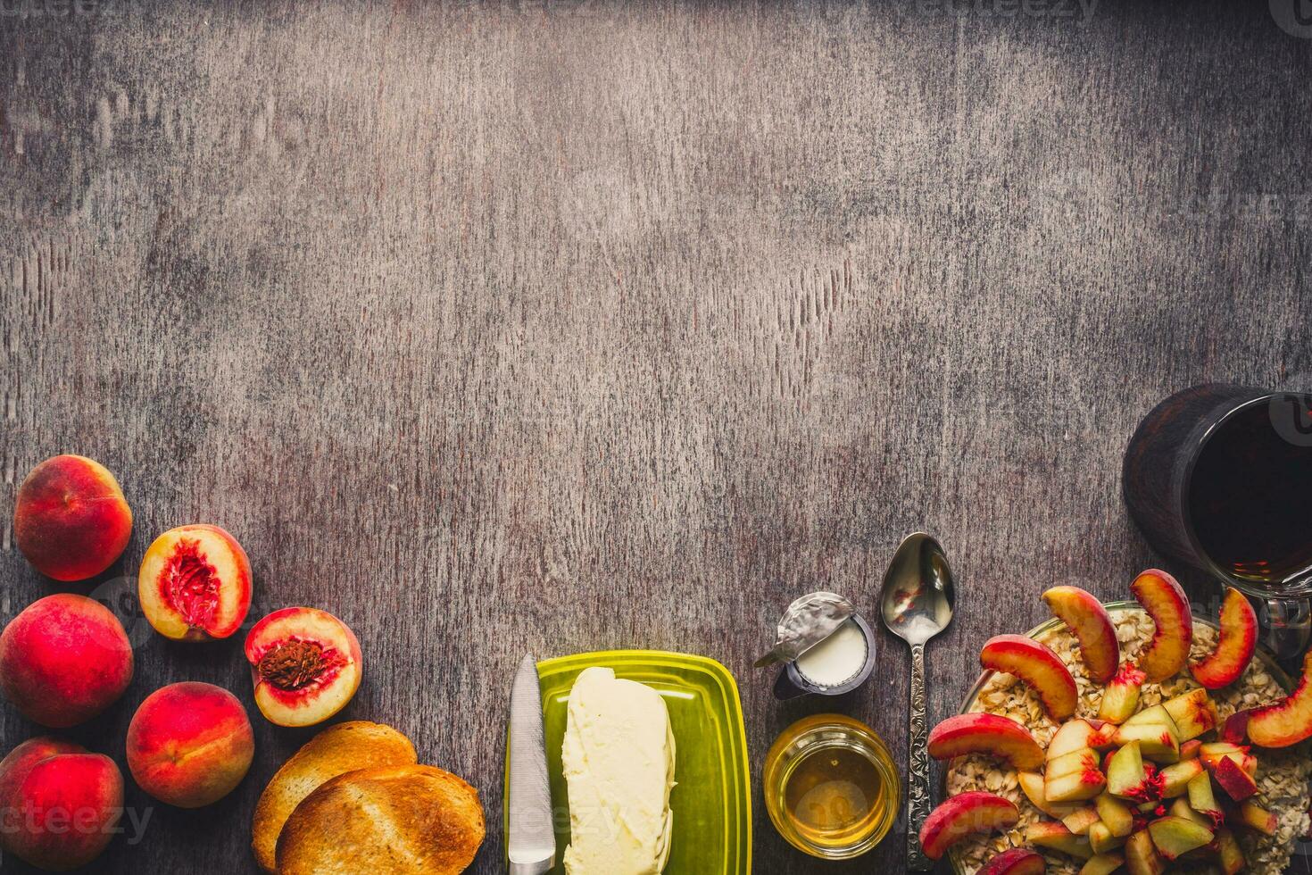 Ingredients for oatmeal on dark wooden table. Concept of healthy food. Top view, copy space. Toned photo