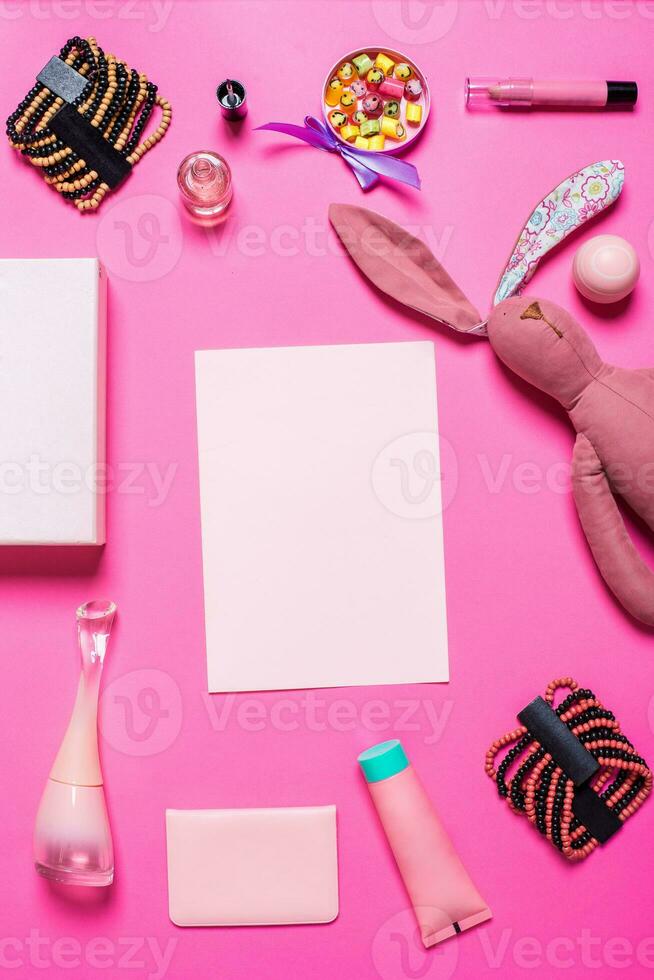 Girl's accessories on a pink background photo