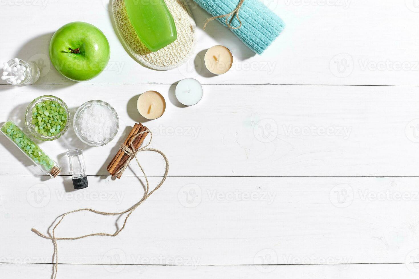 Composition of spa treatment on white wooden table with space for text. Top view photo