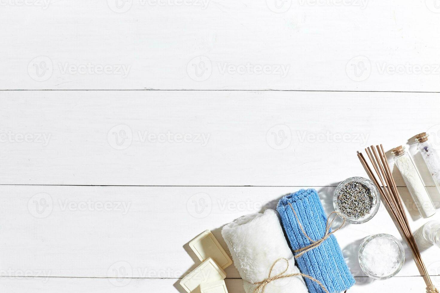 Composition of spa treatment on white wooden table with space for text. Top view photo