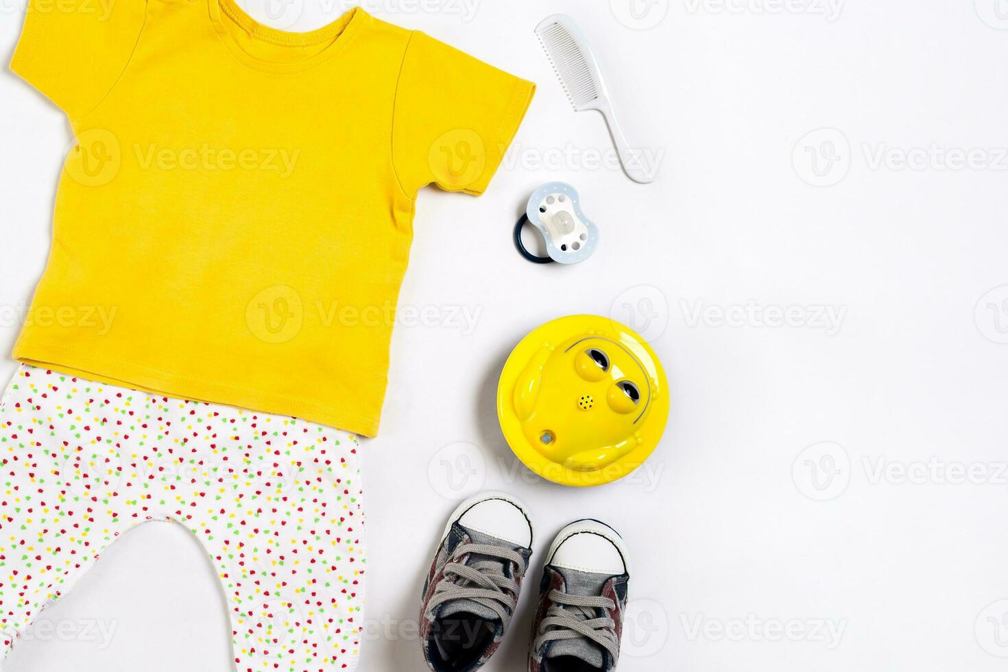 Baby clothes and accessories on white background. Top view photo