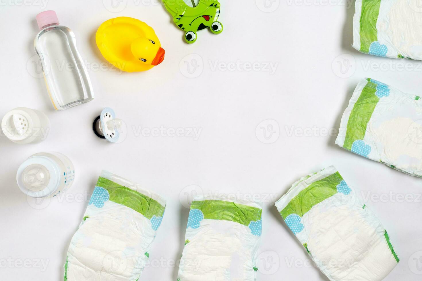 Babies goods diaper, baby powder, cream, shampoo, oil on white background with copy space. Top view or flat lay. photo