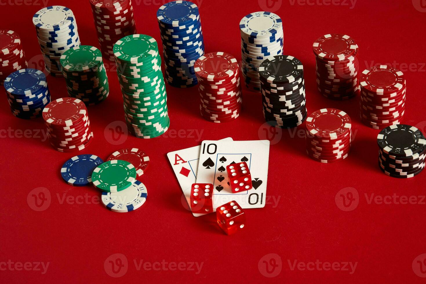 Poker cards and gambling chips on red background photo