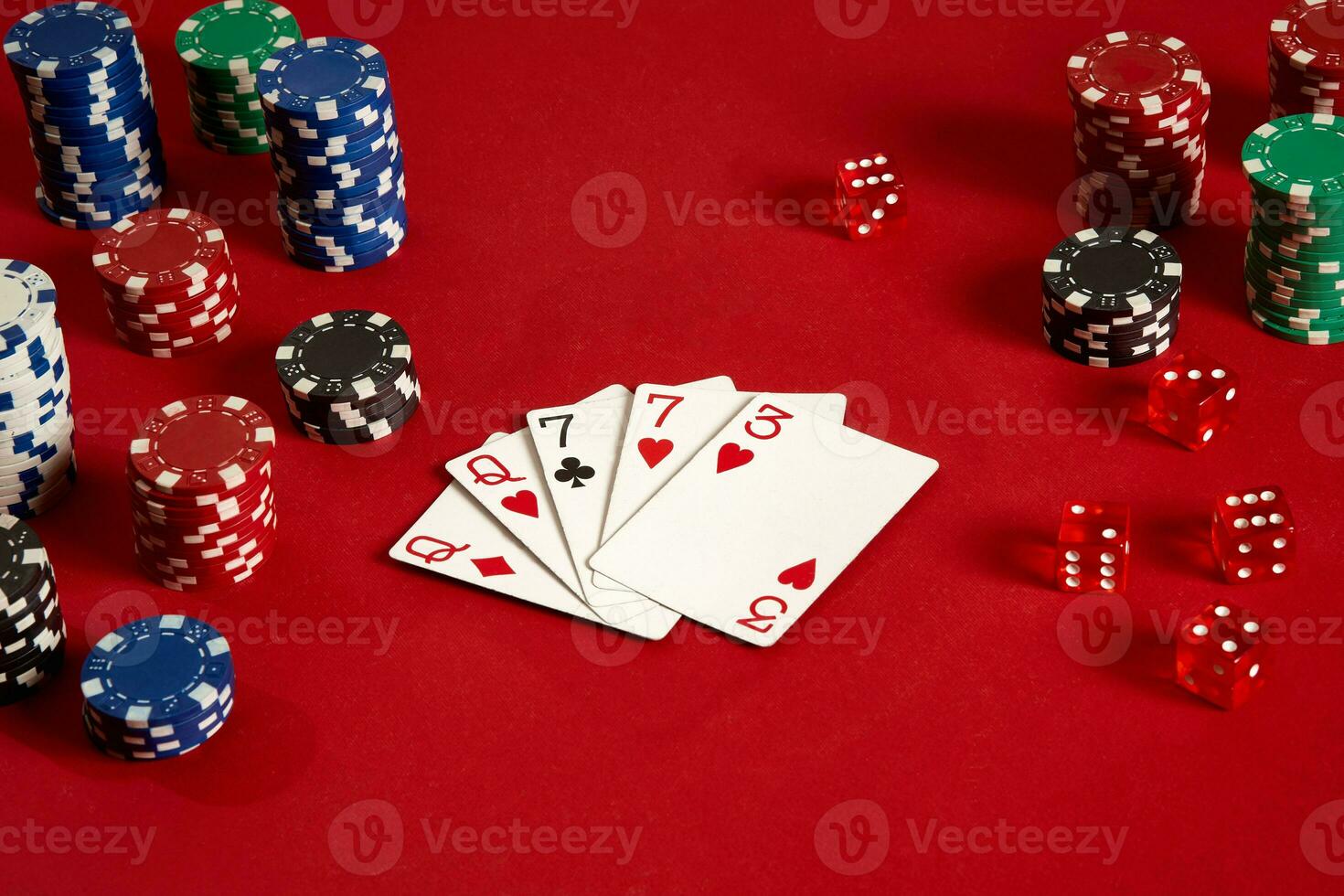 Poker cards and gambling chips on red background photo