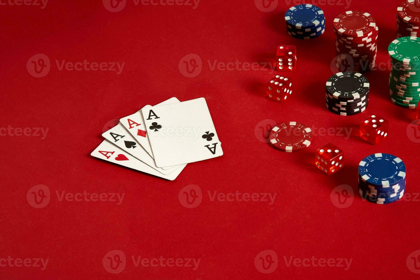 Poker cards and gambling chips on red background photo