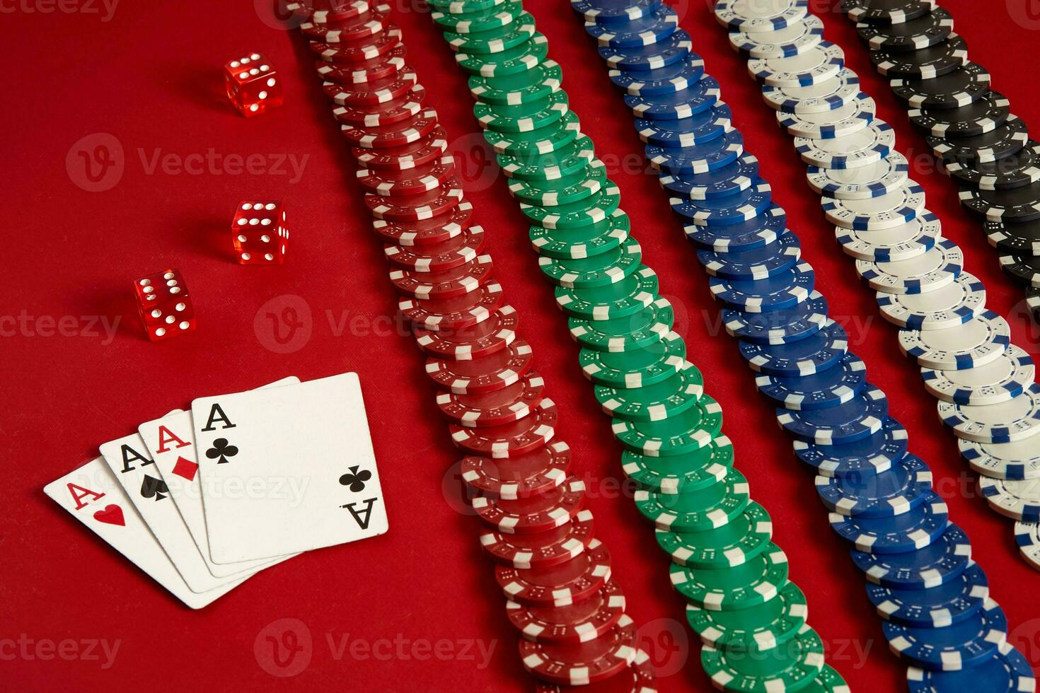 Poker cards and gambling chips on red background photo