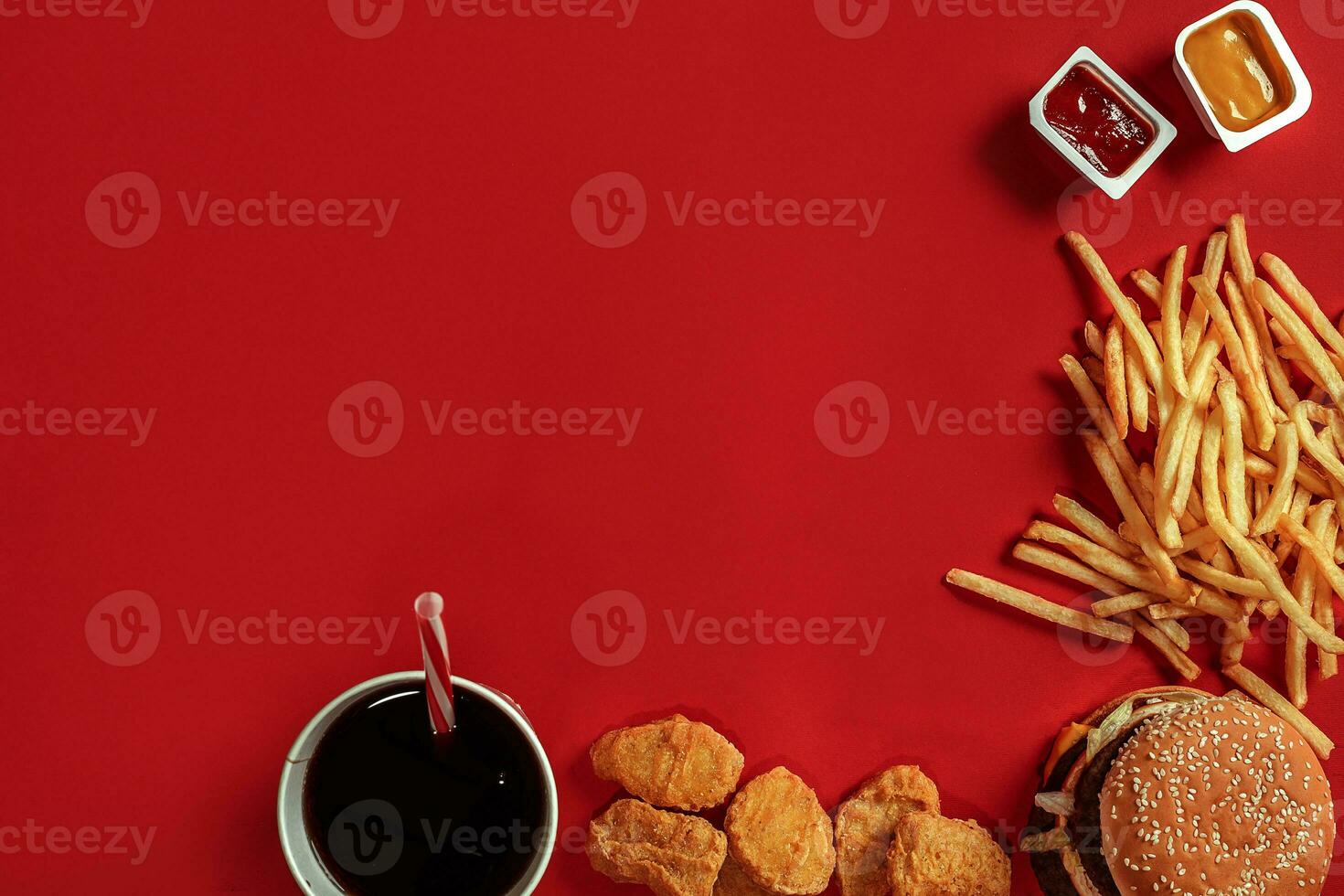 Burger and Chips. Hamburger and french fries in red paper box. Fast food on red background. photo