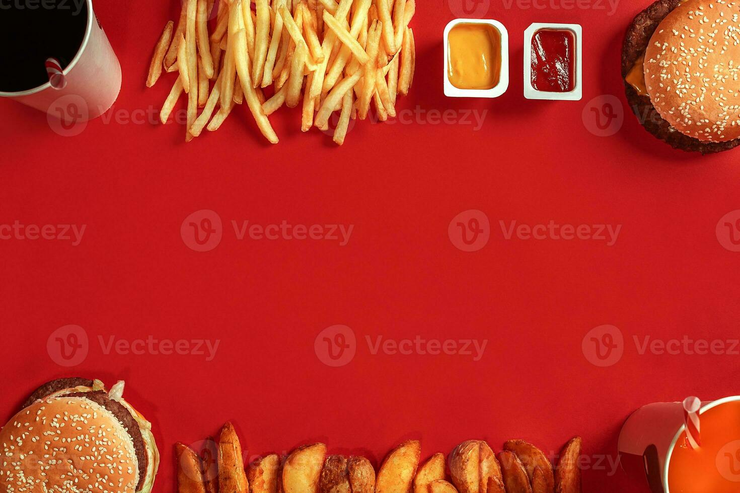 Burger and Chips. Hamburger and french fries in red paper box. Fast food on red background. photo