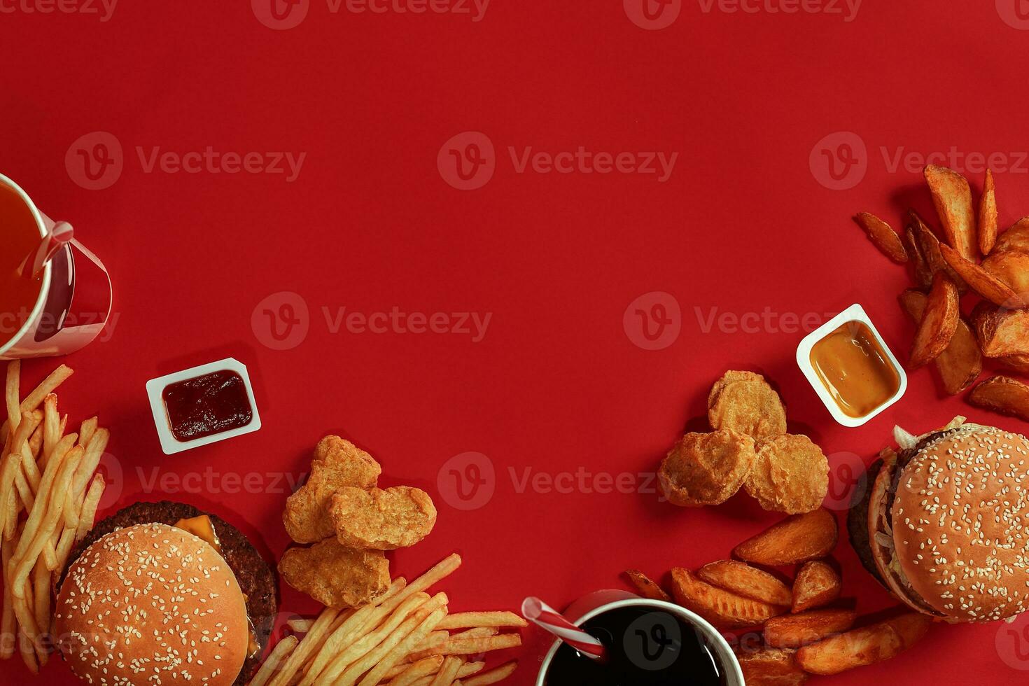 Burger and Chips. Hamburger and french fries in red paper box. Fast food on red background. photo