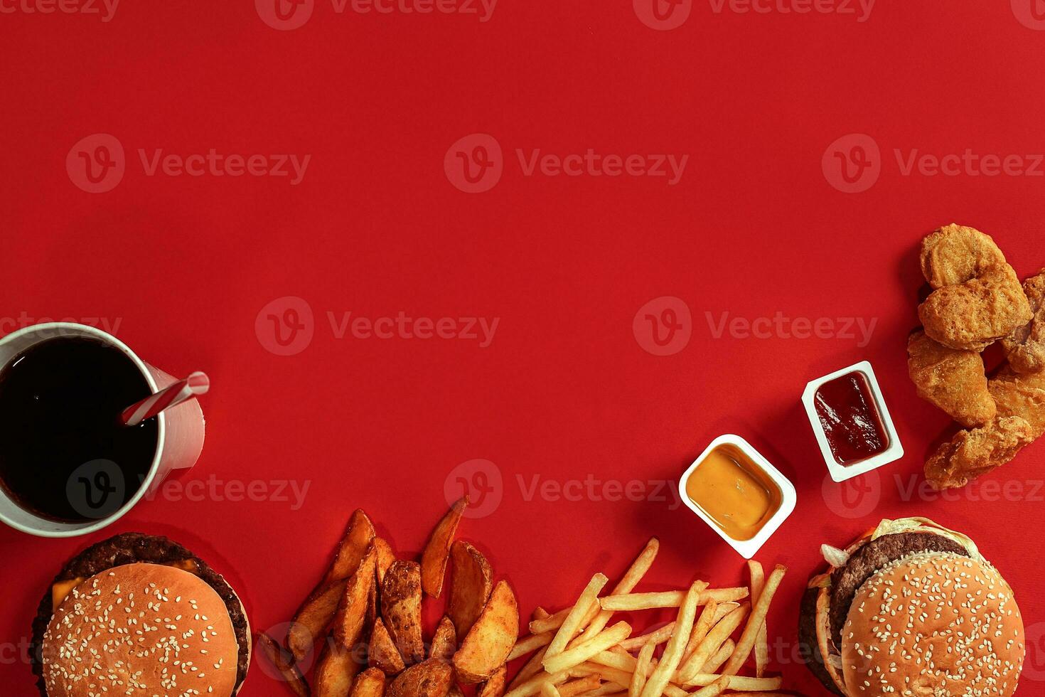 Burger and Chips. Hamburger and french fries in red paper box. Fast food on red background. photo