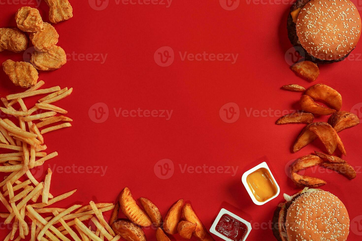 Burger and Chips. Hamburger and french fries in red paper box. Fast food on red background. photo