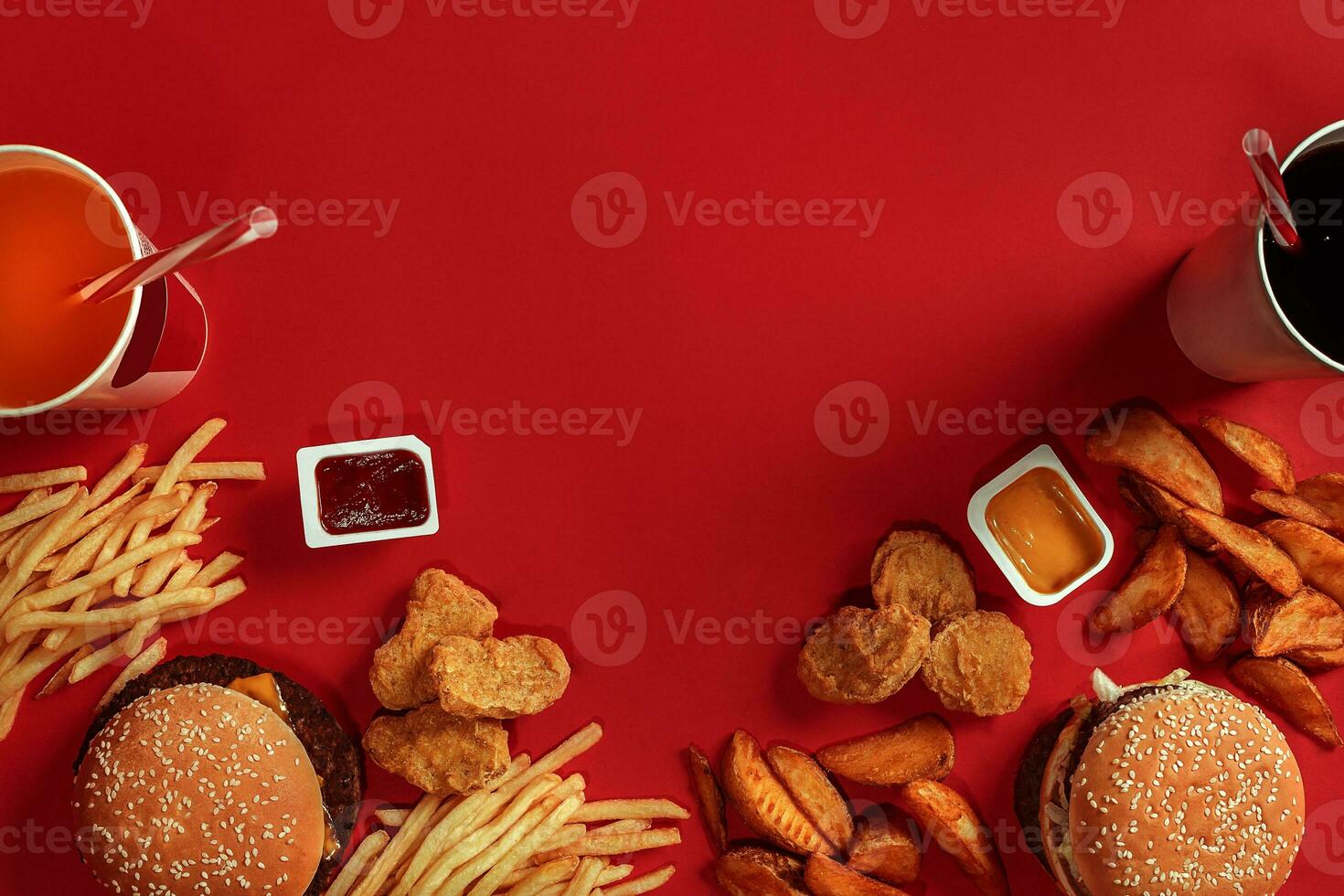 Burger and Chips. Hamburger and french fries in red paper box. Fast food on red background. photo